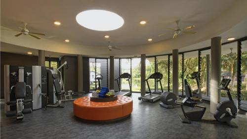 a gym with treadmills and elliptical machines at Mangala Estate Boutique Resort - Small Luxury Hotels of the World in Kuantan