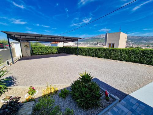 a pavilion with a canopy in a garden at Casa Bella in Split