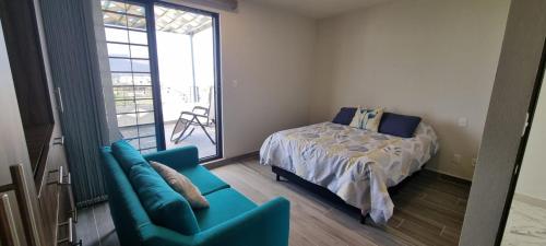 Ένα ή περισσότερα κρεβάτια σε δωμάτιο στο Encantadora casa en Morelos con alberca