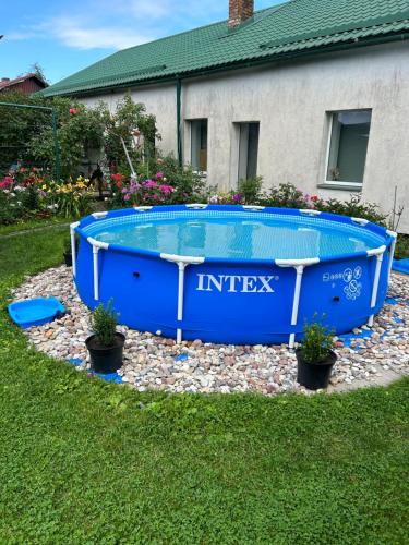 a swimming pool in the yard of a house at Karostas pirts namiņš in Liepāja
