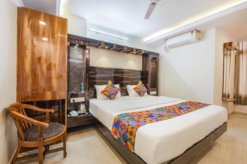 Postel nebo postele na pokoji v ubytování FabHotel SG5 Inn Suites-Yelahanka