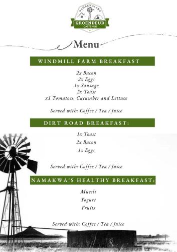 een zwart-witfoto van een windmolen bij Groendeur Guesthouse in Kotzesrus