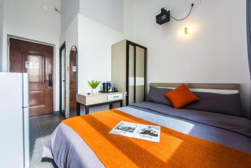 Postel nebo postele na pokoji v ubytování WESU Apartment - Shenzhen Longhua Dalang Fashion Dalang Town Branch