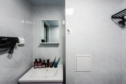 Ένα μπάνιο στο WESU Apartment - Shenzhen Longhua Dalang Fashion Dalang Town Branch
