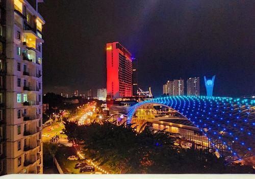 a view of a city at night with a building at Homestay Pulau Pinang Urban Sky Guesthouse in Bayan Lepas