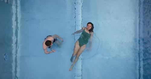 a man and a woman on a water slide at MANNI das Hotel in Mayrhofen