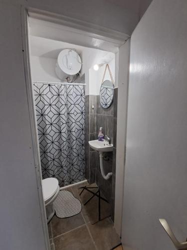 a small bathroom with a toilet and a sink at Sofia apartman in Kolašin