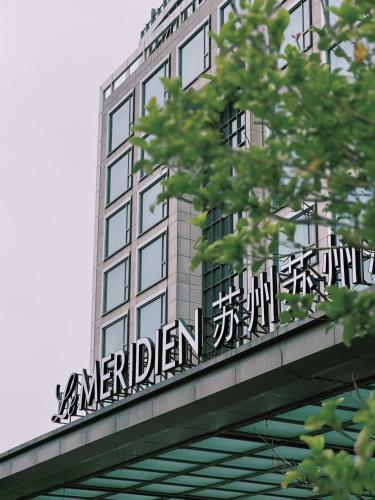 a sign on the side of a building at Le Meridien Suzhou, Suzhou Bay in Suzhou