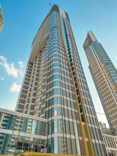 a tall building with two tall skyscrapers at Staybridge Suites Dubai Business Bay by IHG in Dubai