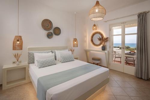 Posteľ alebo postele v izbe v ubytovaní Maria's Rooms & Studios