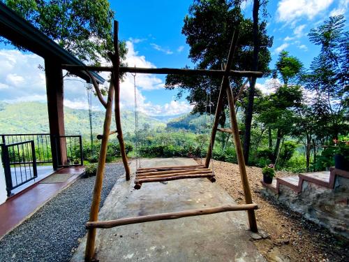 a swing with a view of the mountains at Idyll Cottage Ella in Ella