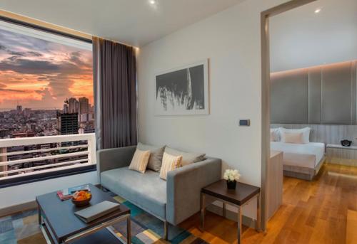 Postel nebo postele na pokoji v ubytování Fraser Suites Sukhumvit Bangkok