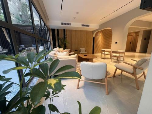 a living room with a couch and a table and chairs at Lacasa Residence in Cairo