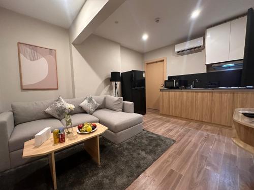 a living room with a couch and a table at Lacasa Residence in Cairo