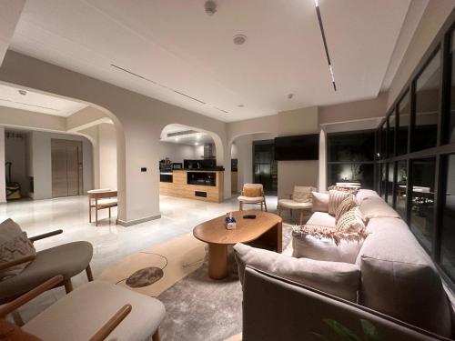 a living room with a couch and a table at Lacasa Residence in Cairo