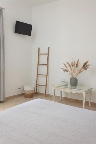 Postel nebo postele na pokoji v ubytování Maria's Rooms & Studios