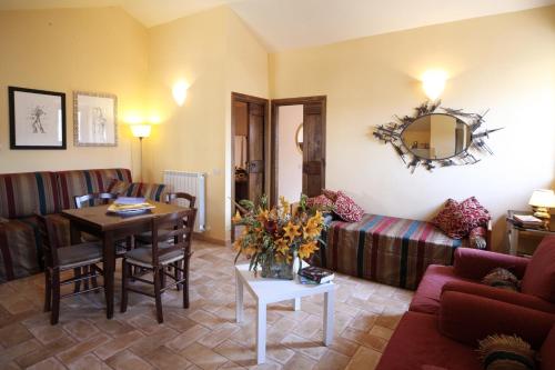 a living room with a couch and a table at Boutique Hotel Campo de' Fiori in Rome