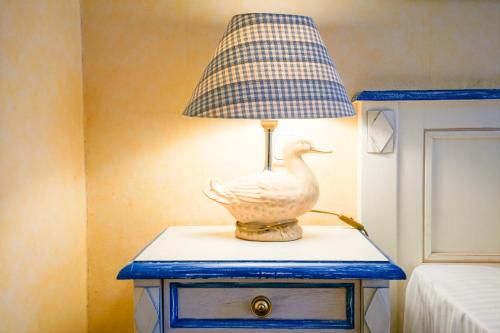 a lamp on a table with a duck on it at Rugard Thermal Strandhotel in Binz