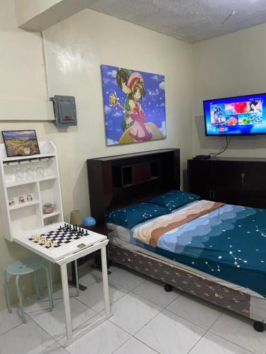 Ένα ή περισσότερα κρεβάτια σε δωμάτιο στο Valenzuela Staycation Netflix and chill