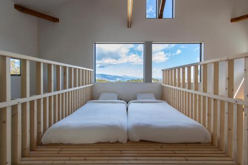 Postel nebo postele na pokoji v ubytování 南熱海 大人と子どもの隠れ家 WonderHutte BBQ可 温泉有 最大14名宿泊可