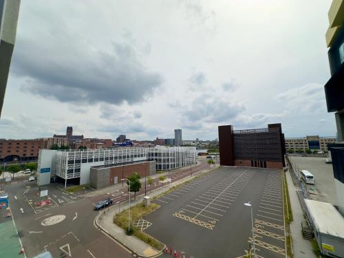 an aerial view of a parking lot in a city at Monarchs Quay Arena Apartments by Happy Days in Liverpool