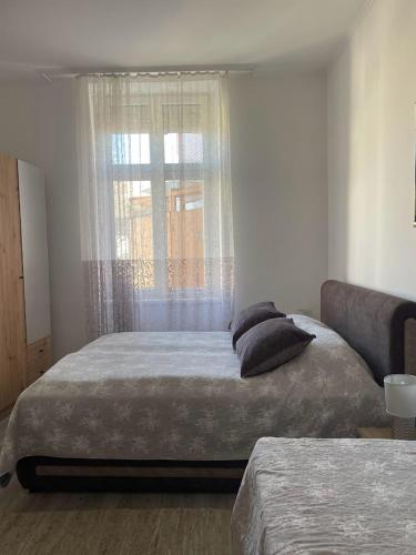 Ένα ή περισσότερα κρεβάτια σε δωμάτιο στο Apartment Milijana