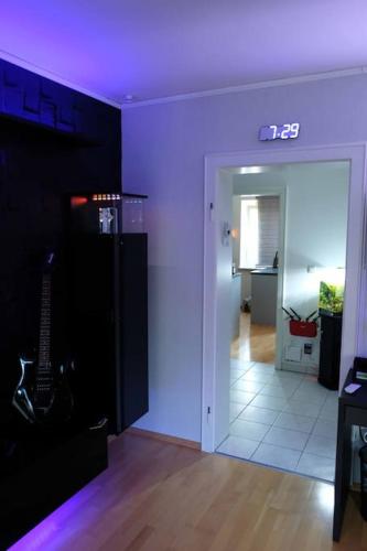 a room with a purple ceiling and a hallway at Luxurious apartment including wellness in Poing