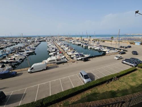 a marina filled with lots of boats in the water at Terrazza a Nettuno e Chiesa Giubilare Santa Maria Goretti in Nettuno