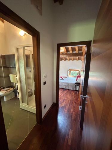a room with a door leading to a bedroom at B&B Corte Bassa 2 in Parma