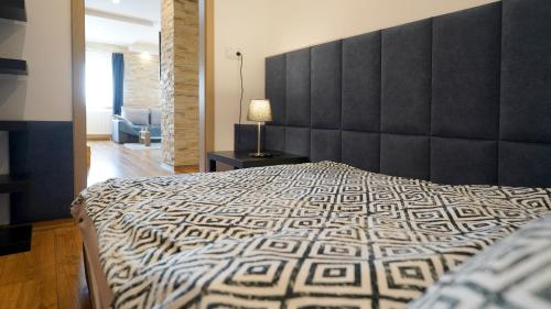 Ένα ή περισσότερα κρεβάτια σε δωμάτιο στο Apartments ALKANTARA