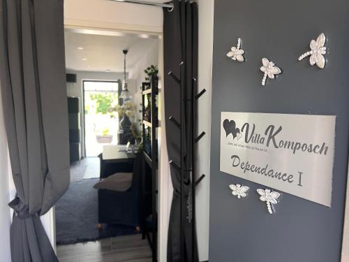 a door to a room with a sign on the wall at Dependance Villa Komposch adults only in Reifnitz