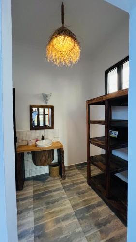 a bathroom with a sink and a mirror at Z-Breeze Zanzibar in Kiwengwa
