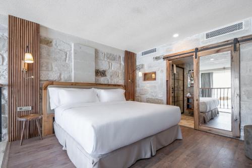 Postel nebo postele na pokoji v ubytování Barceló Cappadocia