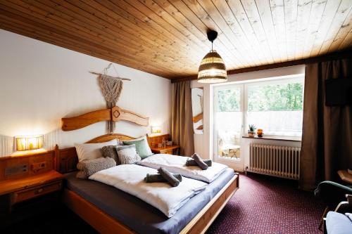 Postel nebo postele na pokoji v ubytování PineTree Lodge Mayrhofen