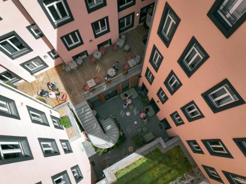an overhead view of a courtyard between two buildings at Hôtel Tandem - Boutique Hôtel in Strasbourg