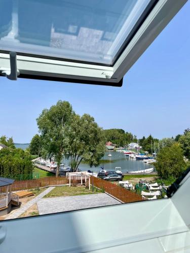 a view of a marina from the window of a vehicle at Biały Port in Rajgród