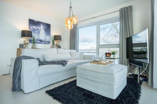 Ένα ή περισσότερα κρεβάτια σε δωμάτιο στο Haus Zur Mole, Wohnung 18 Spinnaker