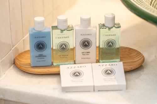 a group of four bottles of soap on a table at CASTA DIVA Luxury Accommodation in Fiskardho