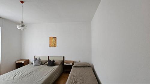 Una cama o camas en una habitación de Appartamenti Mulàr