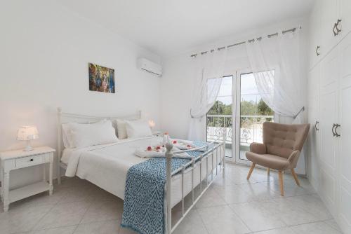 Postel nebo postele na pokoji v ubytování Nimo Paradise Estate
