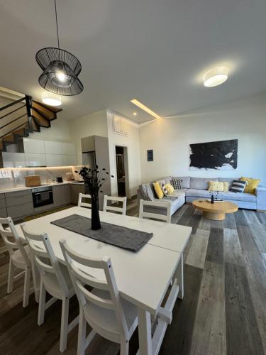 A television and/or entertainment centre at Aelia Luxury Beach House