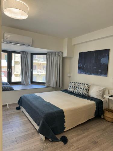 A bed or beds in a room at Aelia Luxury Beach House