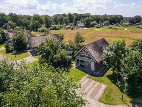 an aerial view of a house in a field at Summio Buitenplaats de Marke van Ruinen in Ruinen
