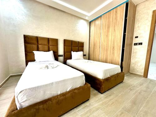 Postel nebo postele na pokoji v ubytování appartment igar azougagh elhoceima