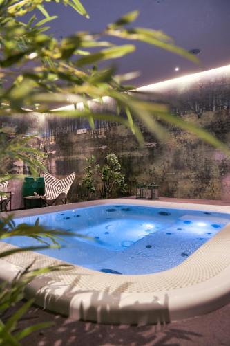 a large swimming pool in the middle of a building at Palazzo Sangiorgio in Catania