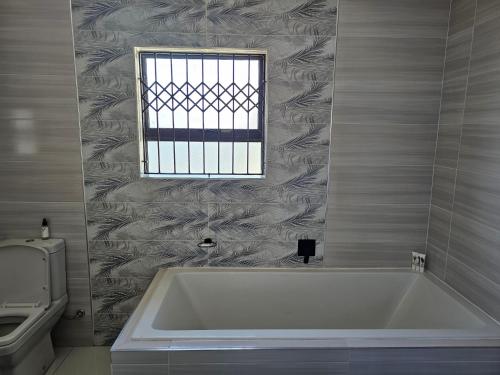 Bilik mandi di Prime Nest Guest Apartments