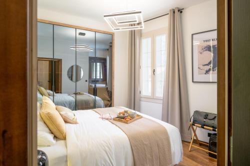 Postel nebo postele na pokoji v ubytování Les Maisons d Anthony Marseille
