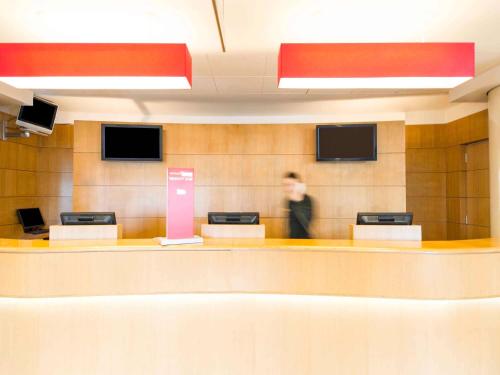Televízia a/alebo spoločenská miestnosť v ubytovaní Hotel Ibis Firenze Nord Aeroporto