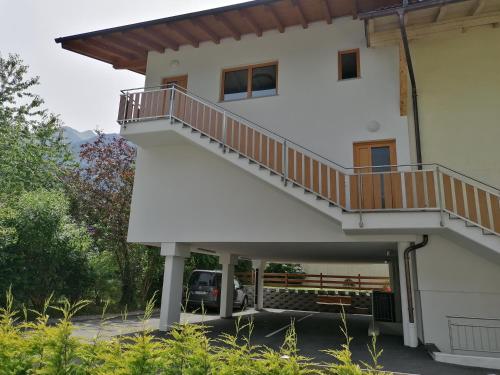 a white house with a staircase and a bench at Apartment Eberharter in Mayrhofen