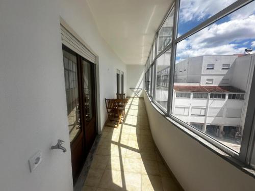 an empty balcony with a view of a building at João Paulo II Apartment in Fátima